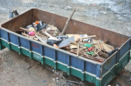 Commercial waste removal truck in Turnham Green streetscape