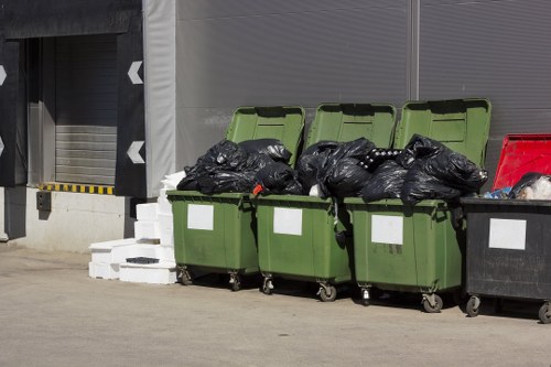 Experienced professionals sorting and recycling items during house clearance